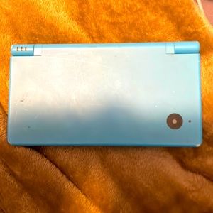 Nintendo DSI needs a charger, comes with one game.